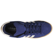 A top-down view of a blue Adidas sneaker with white three-stripes and a gum-colored sole.