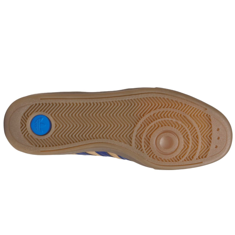 The outsole of a shoe shown from a top-down view, featuring a brown textured rubber tread with a circular blue accent on the heel.