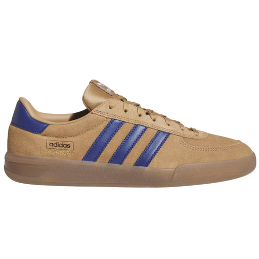 An Adidas Samba sneaker in tan suede with royal blue stripes and heel tab.
