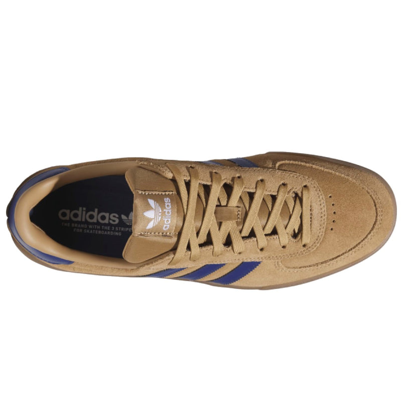 A top-down view of an Adidas Glenburn sneaker in tan suede with blue stripes and a dark navy interior.