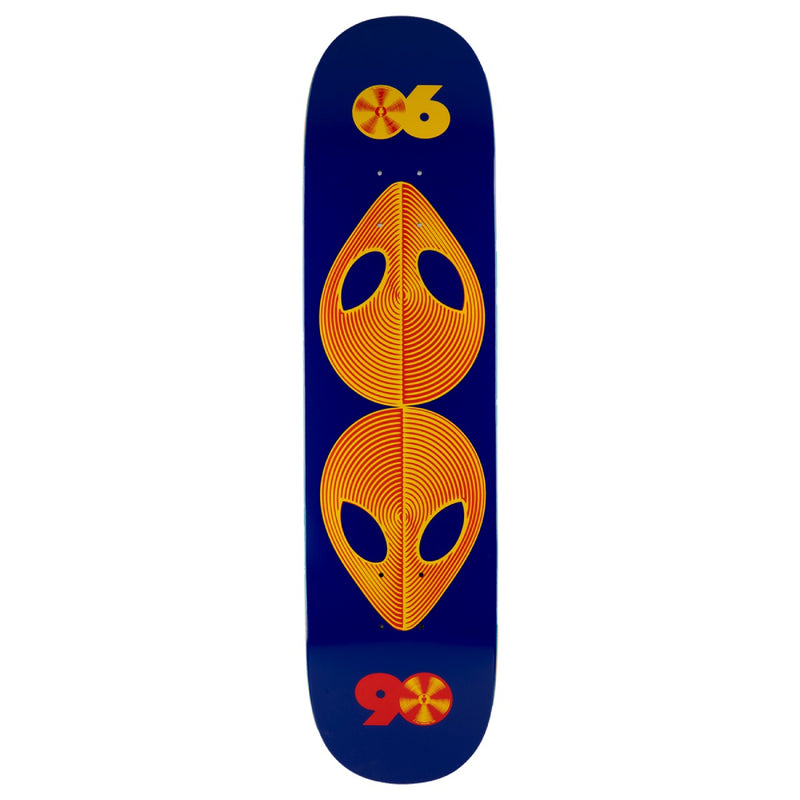 A skateboard deck with a dark navy blue background, featuring a large orange alien head graphic in the center and matching orange and red logo graphics near the top and bottom.