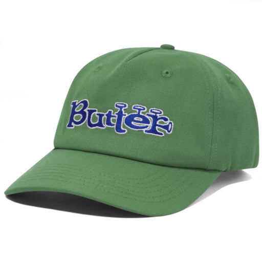 Butter Goods Trumpet Snap Back - Sage A green baseball cap with 'Butter' embroidered in blue and white cursive text on the front.