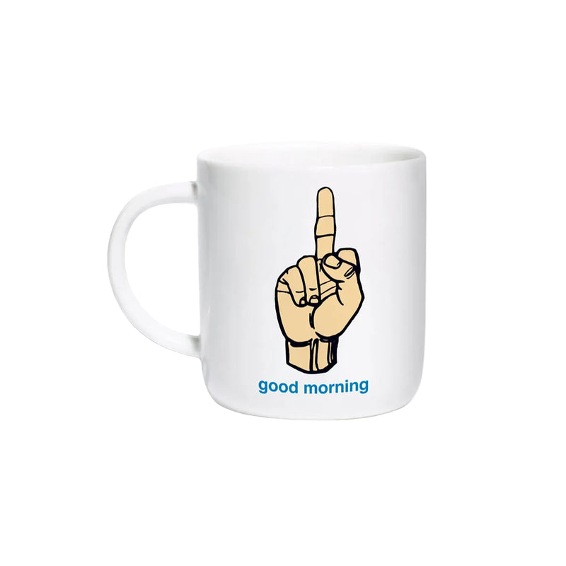 A Enjoi white ceramic mug featuring a cartoon illustration of a hand showing the middle finger, with the text 'good morning' printed in blue below it, set against a plain white background.