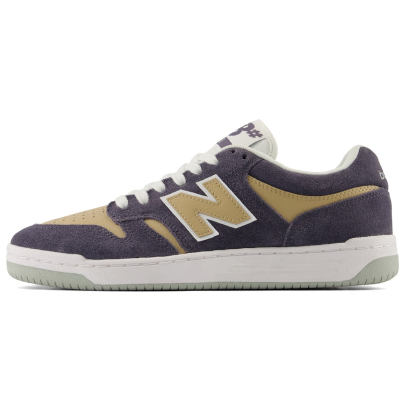 A New Balance sneaker in dark Grey suede and tan suede, featuring a white midsole and a light green outsole.