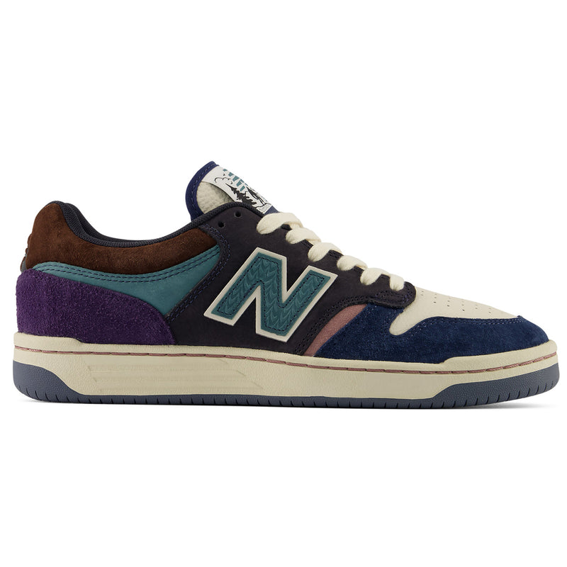 New Balance Numeric 480 x 35th North sneaker in a multi-color colorway featuring navy suede, purple suede, teal suede, brown suede, cream leather, and a dark navy outsole, shown from a side profile on a white background.