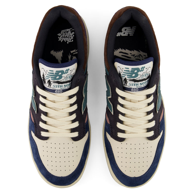 New Balance Numeric 480 x 35th North sneakers shown from a top-down view. The shoes feature cream suede overlays, navy blue suede panels, dark brown suede toe boxes, and teal accents on the tongue and side stripes.