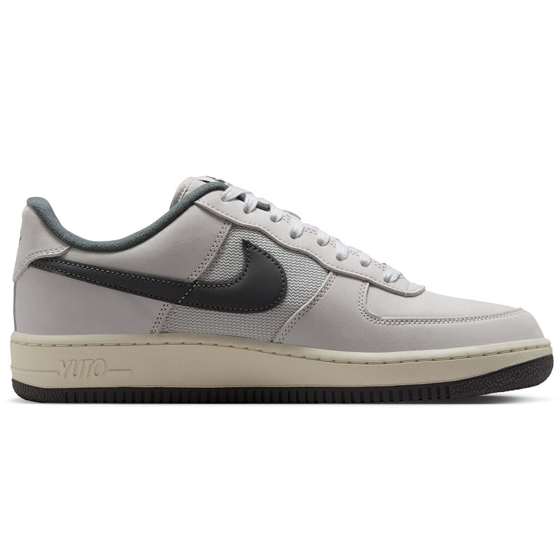  Nike SB Air Force 1 x Yuto sneaker in light gray with a dark gray Swoosh, matching gray laces, and a cream-colored midsole.