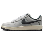  Nike SB Air Force 1 x Yuto sneaker in light gray and dark gray, featuring a cream-colored midsole and a black outsole, shown from a side profile view on a white background.
