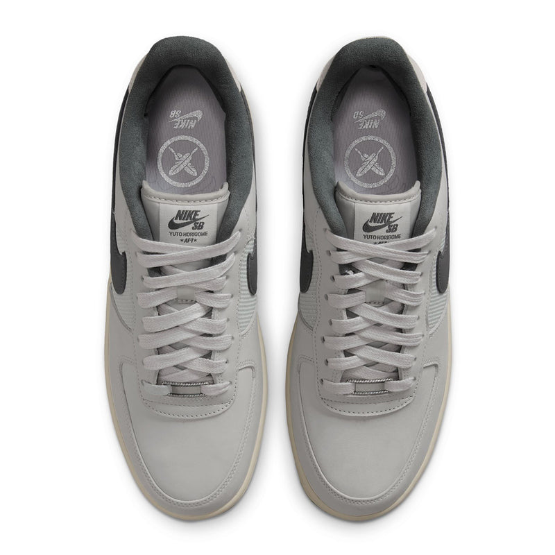  Nike SB Air Force 1 x Yuto sneakers in light gray, shown from a top-down view on a white background.