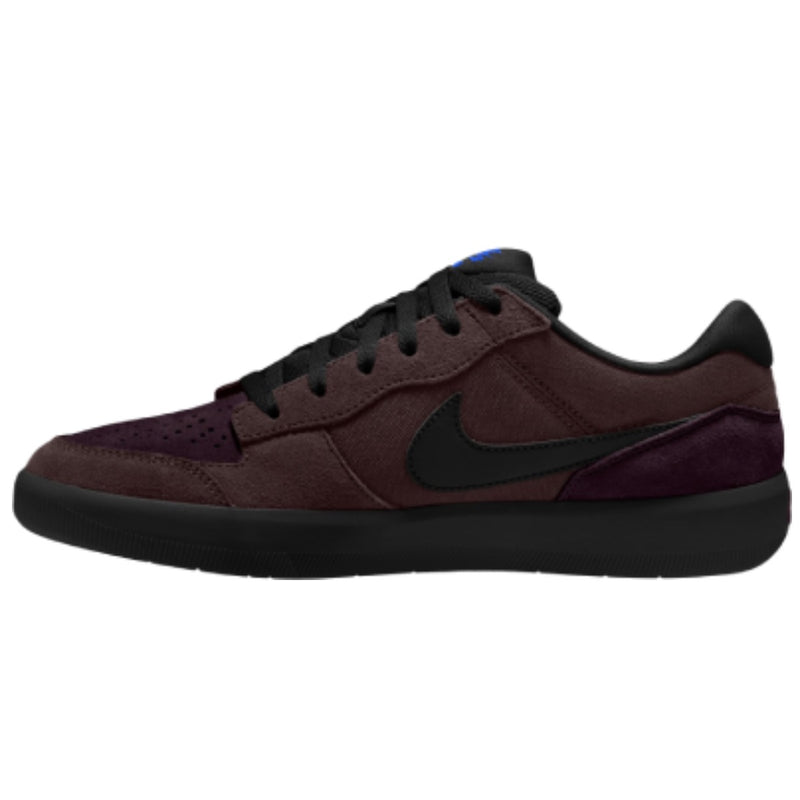 A Nike low-top sneaker in dark burgundy and black suede, featuring a black Swoosh and a small blue accent on the tongue.
