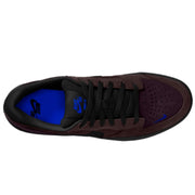 A Nike SB Force 58 sneaker shown from a top-down view. The shoe features a dark brown suede and synthetic leather upper with black laces, a black outsole, and a vibrant blue interior lining and logo accents.