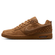 A Nike low-top sneaker in a monochromatic brown colorway, featuring suede and textured mesh panels, a quilted pattern on the heel, and a gum sole.