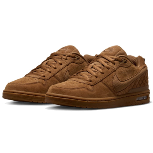 A pair of Nike SB Paul Rodriguez 1 Low sneakers in a monochromatic brown colorway, featuring suede and textured mesh panels, laces, and a gum sole.