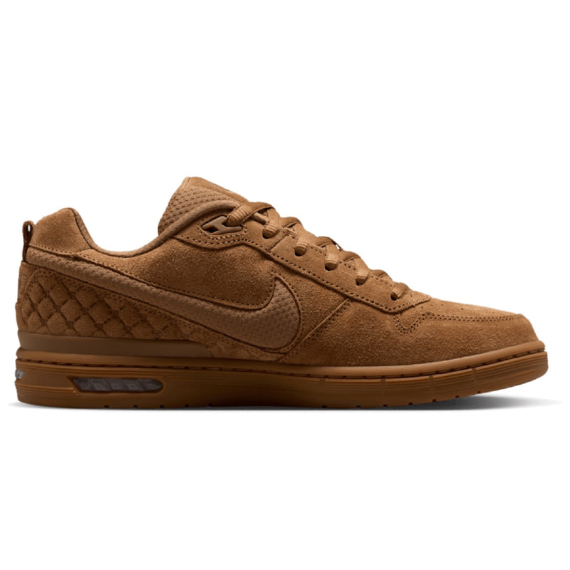 A single Nike low-top sneaker in a monochromatic brown colorway, featuring suede and textured leather panels, matching laces, and a gum sole.