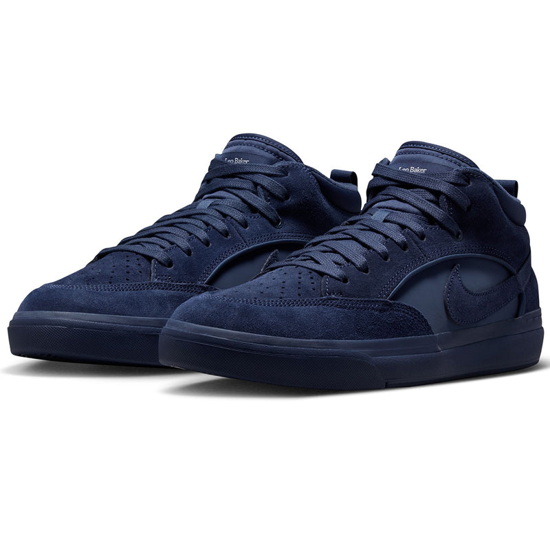 Nike SB React Leo - Navy/Navy A pair of Nike high-top sneakers in a dark navy blue suede and synthetic fabric, featuring matching navy laces, a dark navy swoosh on the side, and a dark navy sole