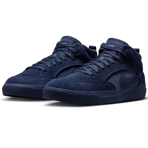 Nike SB React Leo - Navy/Navy A pair of Nike high-top sneakers in a dark navy blue suede and synthetic fabric, featuring matching navy laces, a dark navy swoosh on the side, and a dark navy sole