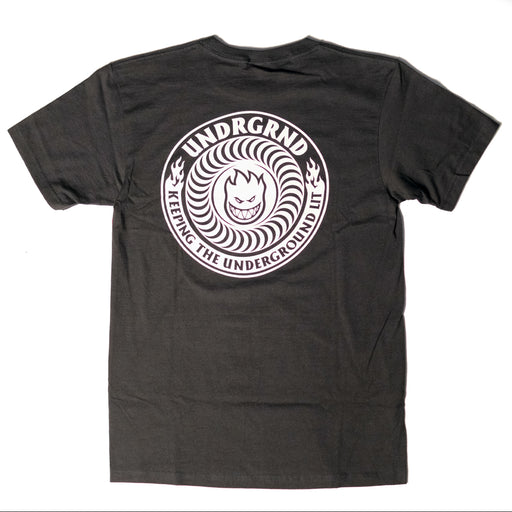 A black Spitfire t-shirt shown from the back, featuring a large white circular graphic print with the text 'UNDGRND' and 'KEEPING THE UNDERGROUND UNDERGROUND' surrounding a stylized face.