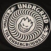 A close-up of a black circular graphic print featuring a white stylized snake coiling around a snarling face, with the text 'UNDRGRND' and 'KEEPING THE UNDERGROUND LIT' in white.