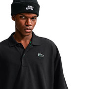 Nike SB Solid Break AF1 Polo in Black / Court Green, collar and AF1 chest patch detail on model
