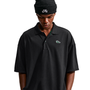 Nike SB Solid Break AF1 Polo in Black / Court Green, front view on model